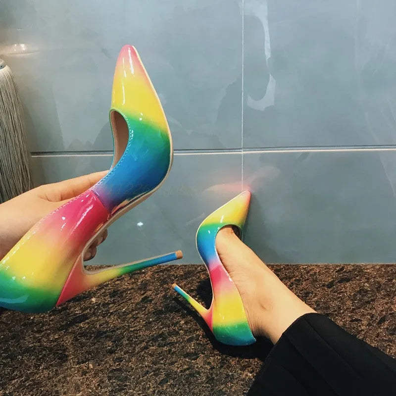 Rainbow patent leather women's ultra-high heel pointed toe stiletto pump shoes on white background