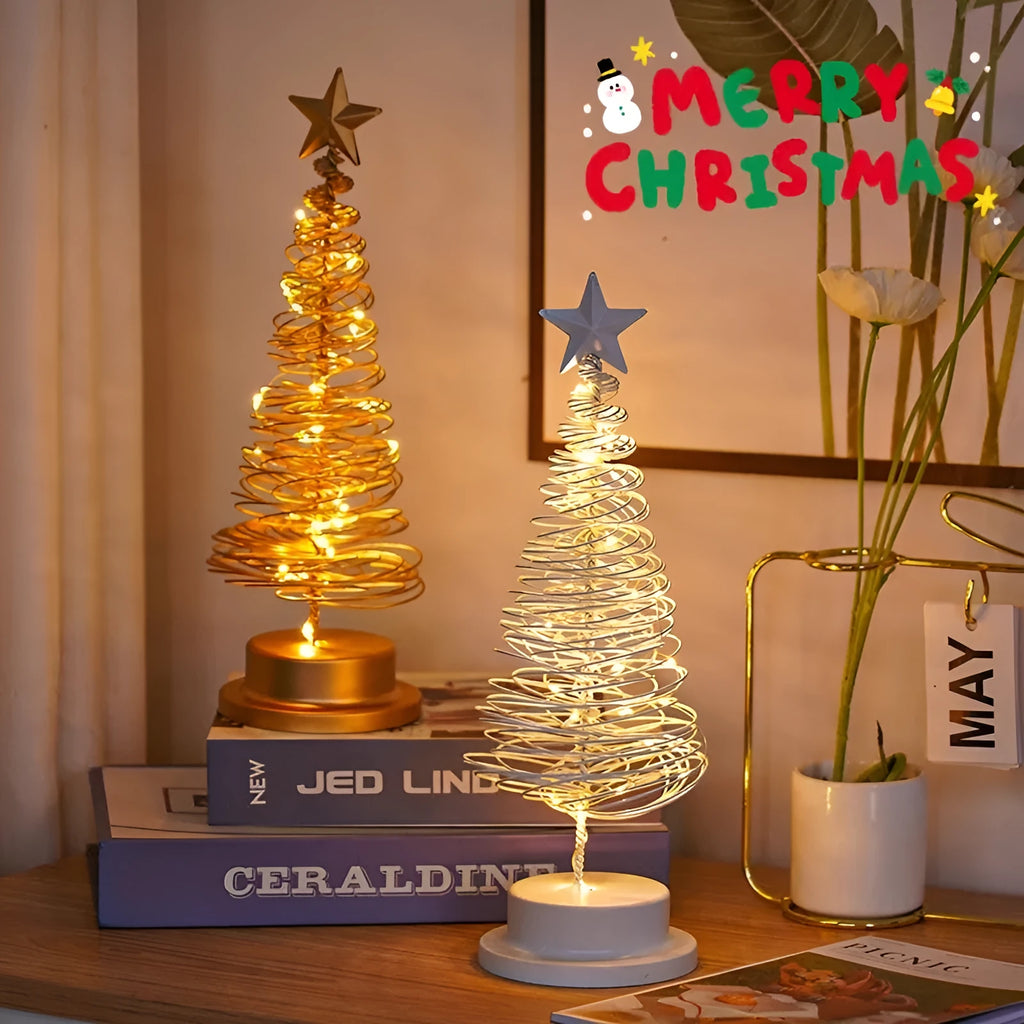 LED Christmas tree spiral light ornament with warm white glow on a table, gold finish