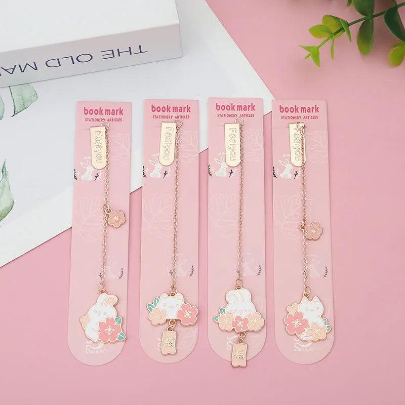 Creative cartoon metal pendant bookmark with cute cherry cat design in sakura style on white background