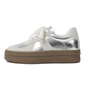Retro round toe casual board shoes with cross shoulder straps, shown in milky white colour.