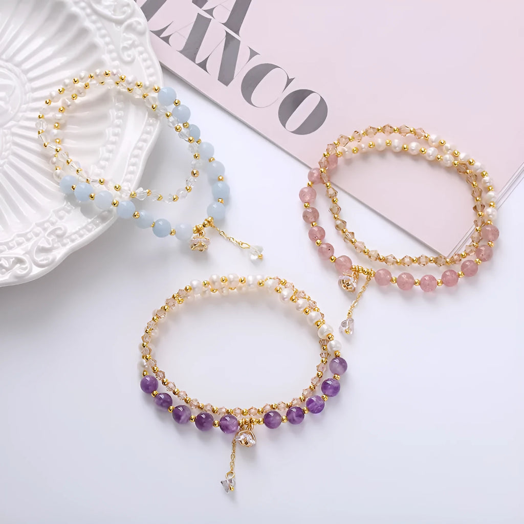 Handmade crystal double ring bracelet with natural freshwater pearl in strawberry quartz colour on wrist