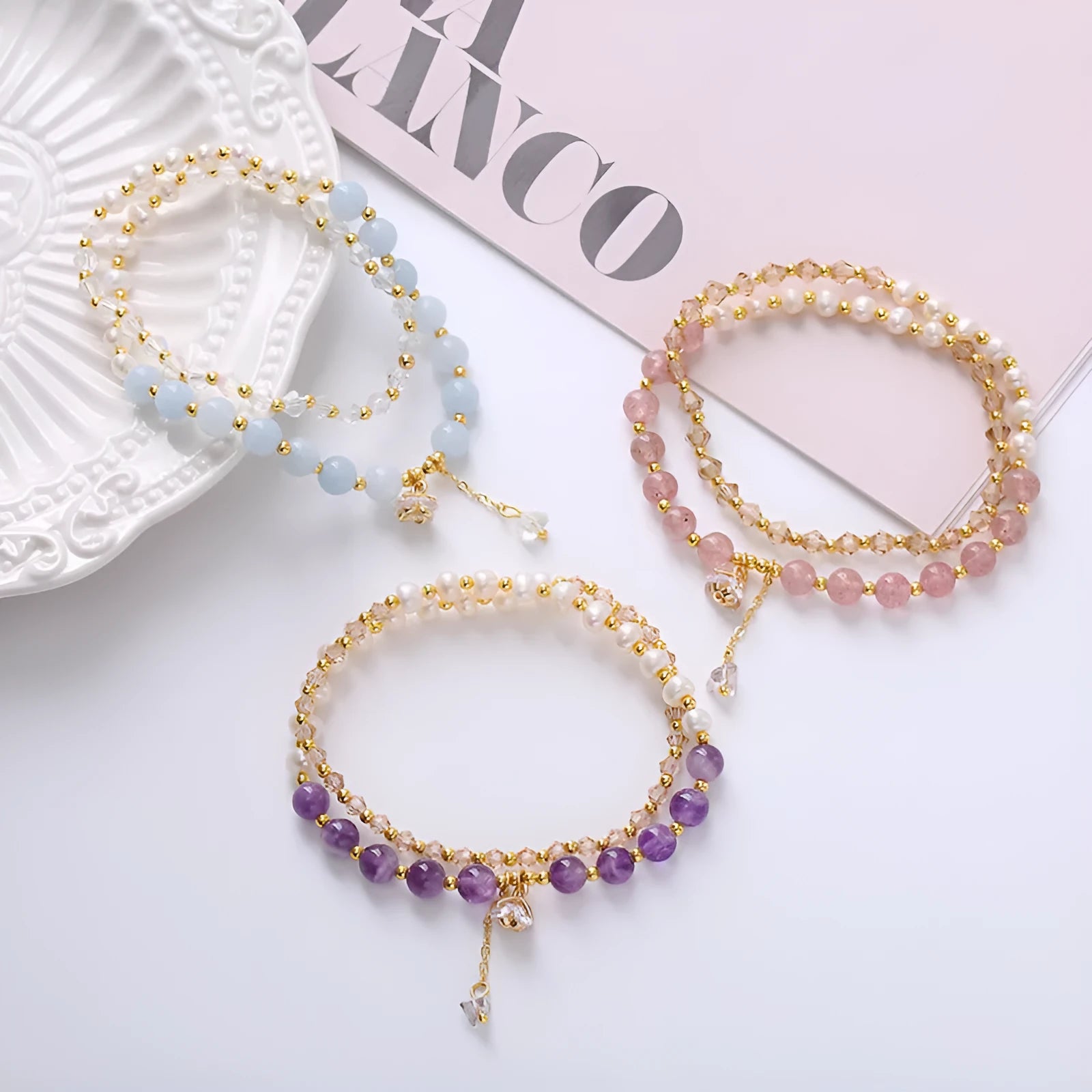 Handmade crystal double ring bracelet with natural freshwater pearl in strawberry quartz colour on wrist