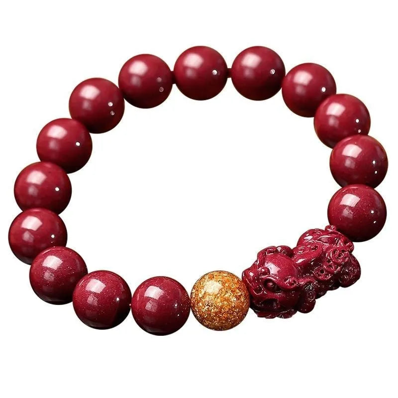 Cinnabar bracelet with purple gold sandstone colour, polished finish, and totem pattern on beads