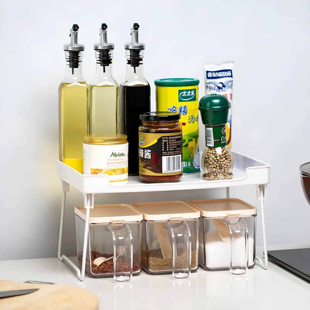 Plastic kitchen supplies rack on desktop, transparent finish, with assorted spice jars