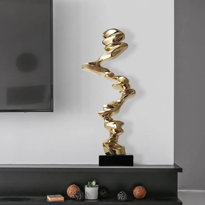Modern abstract still life sculpture ornament in bright gold, elegant silver, or phantom blue.
