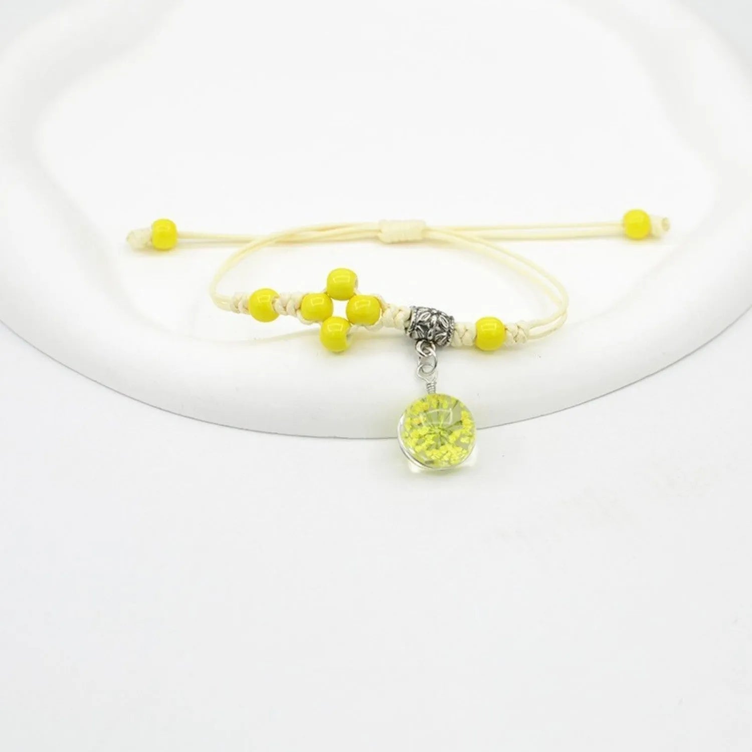 Glass dried flower bracelet with lace detailing and large 1.4cm beads in multiple colours.