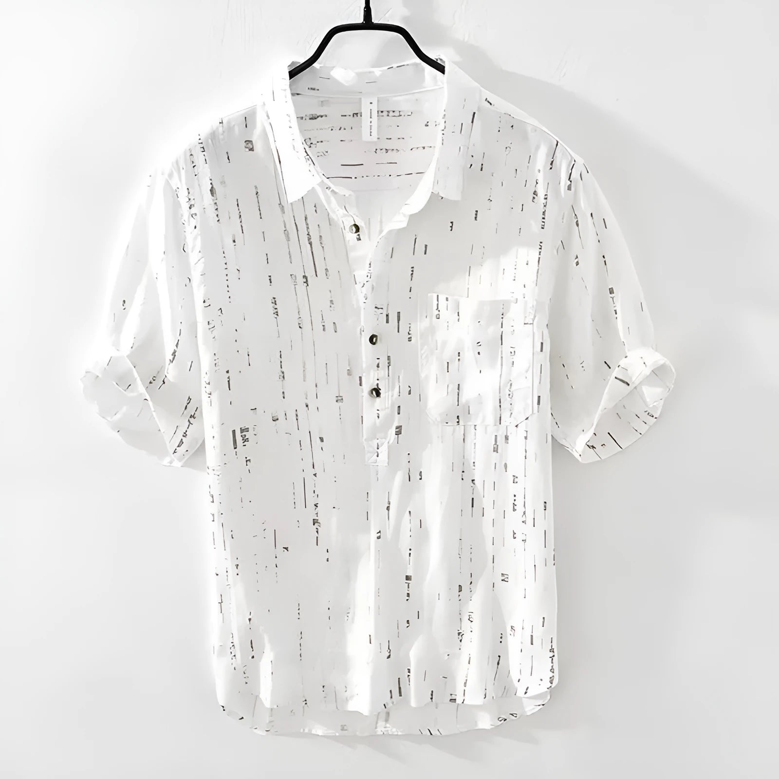 Men's loose fit short sleeve lapel polo shirt in black or white, shown on a hanger.