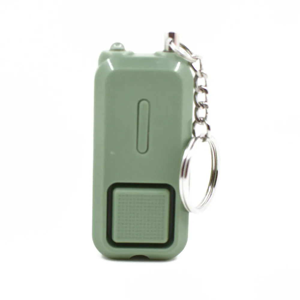 ZQ-202 personal safety alarm in pink, showing compact size and keychain attachment.