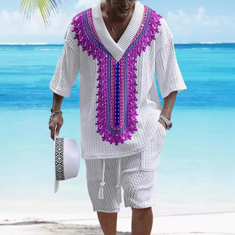 Man wearing a printed drop-shoulder knitted short-sleeved top with matching shorts in a casual setting.