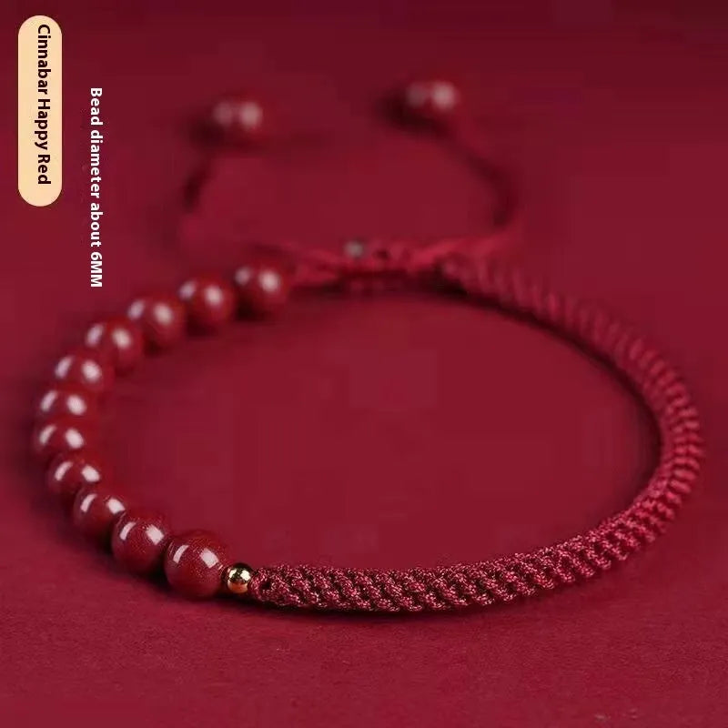 Braided rope bracelet with cinnabar beads in 8mm diameter and wine red colour