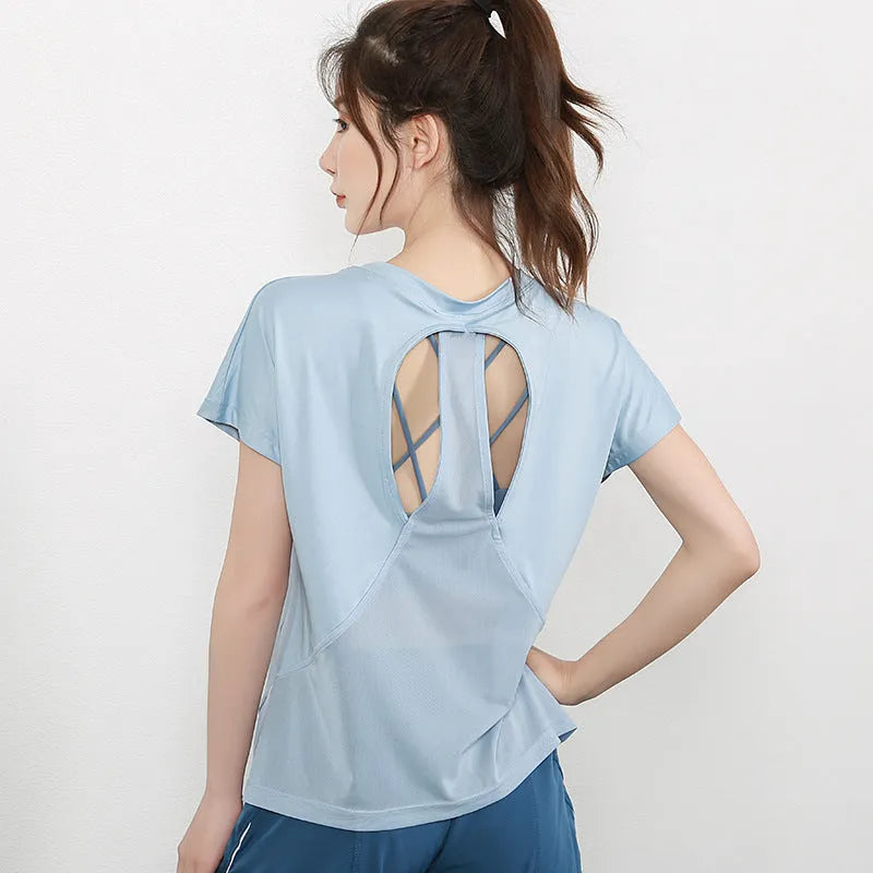 Women's pink short sleeve polyester sports t-shirt for running and fitness.