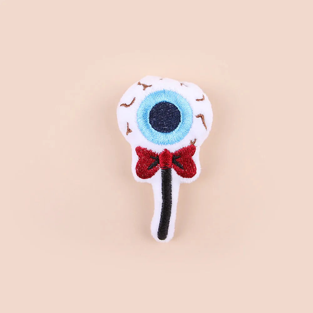 Small plush cat teaser toy with wand and colourful attachments for feline play