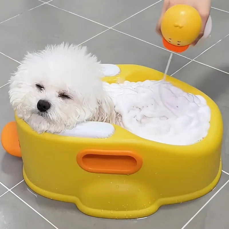 Blue PVC duck-shaped bathtub for washing small dogs and cats on a white background
