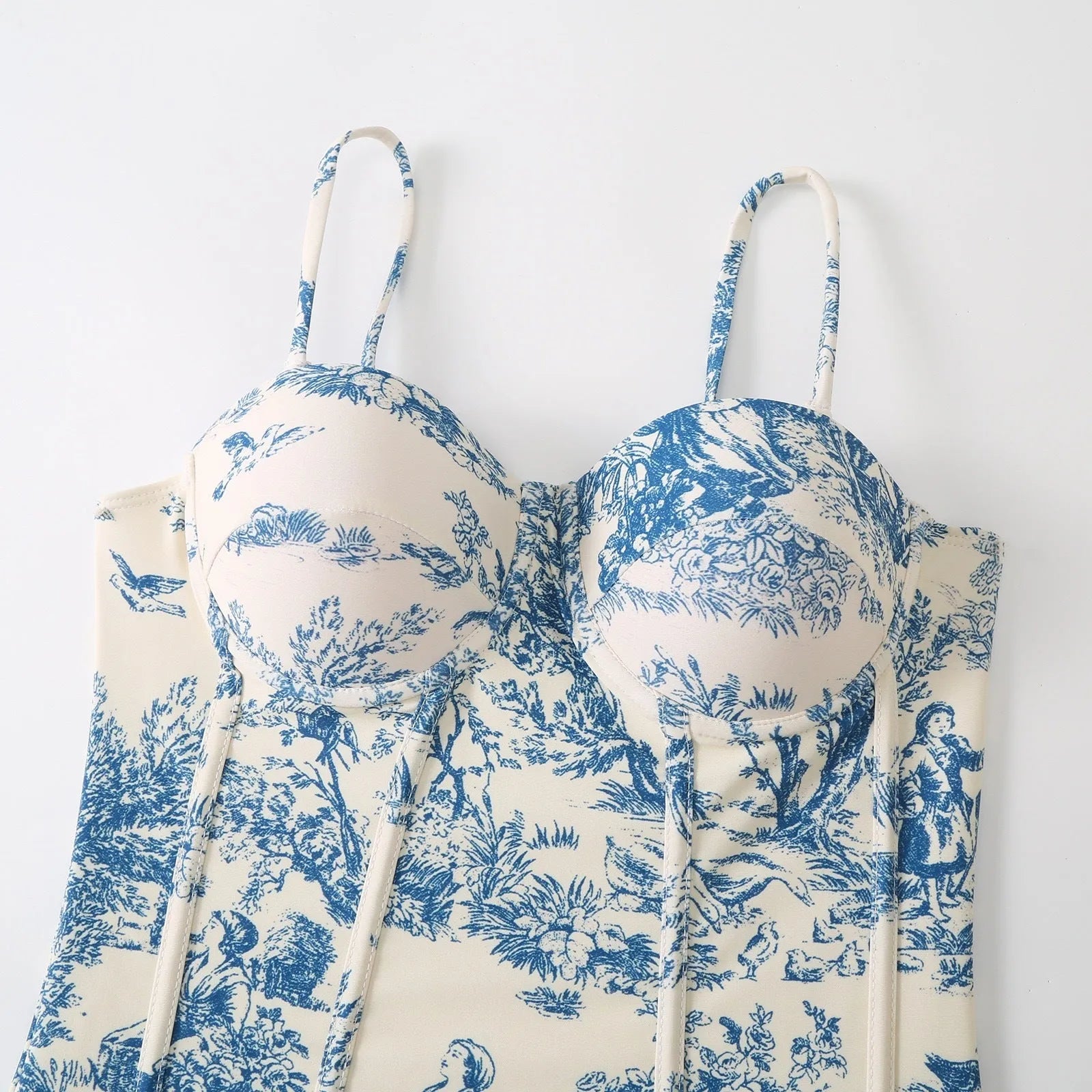 Blue patterned one-piece swimsuit for women with a matching lightweight gauze skirt cover-up.