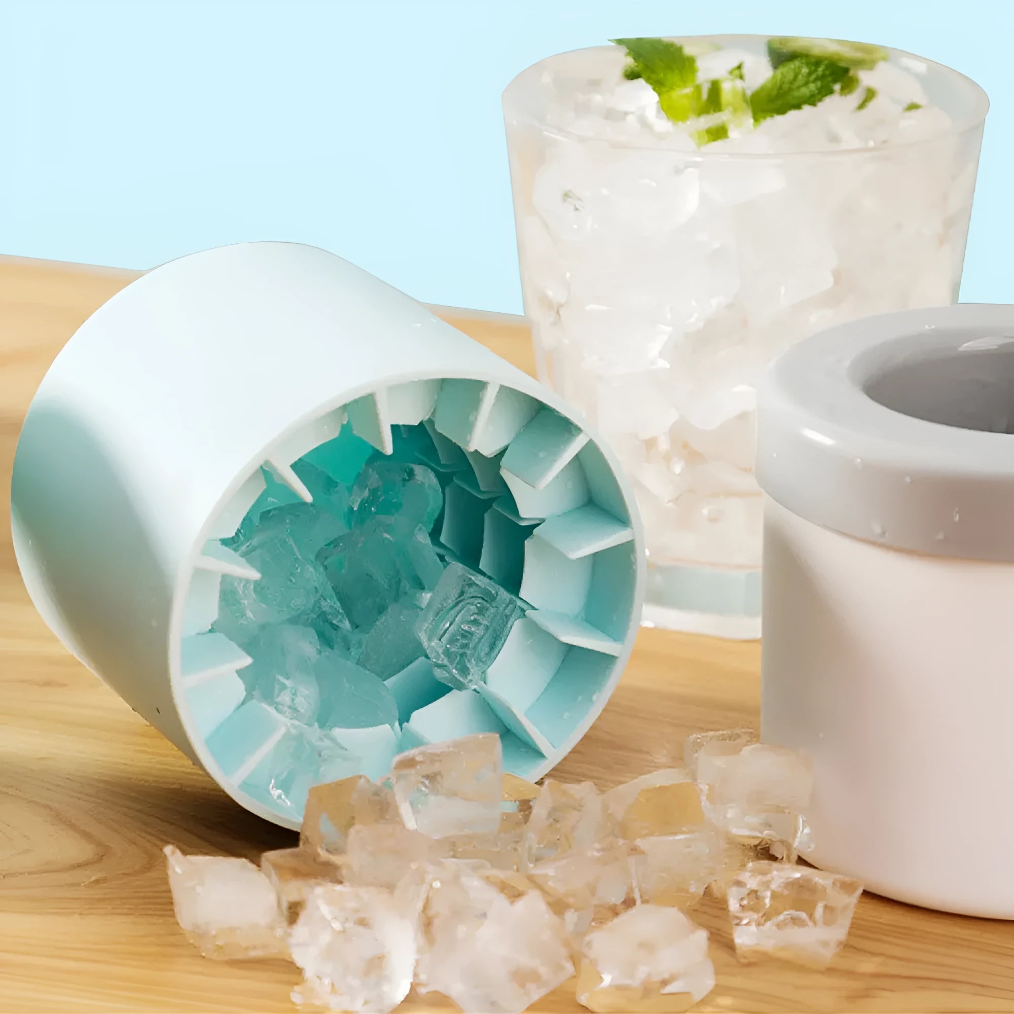 Portable 2-in-1 ice bucket mold with lid made of food-grade silicone in blue-green colour
