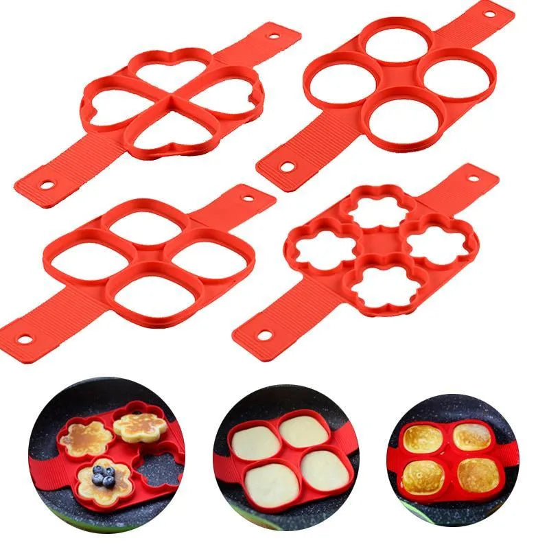 Red silicone nonstick pancake egg ring maker on a cooking surface with a round egg inside