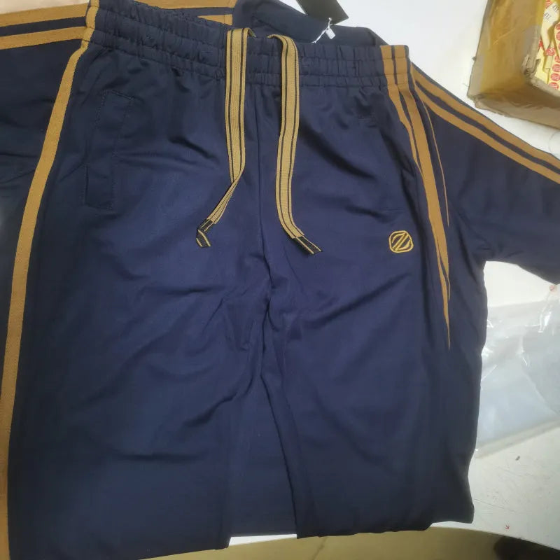 Man wearing a blue ironing-free short sleeve ice silk suit set, showing top and trousers.