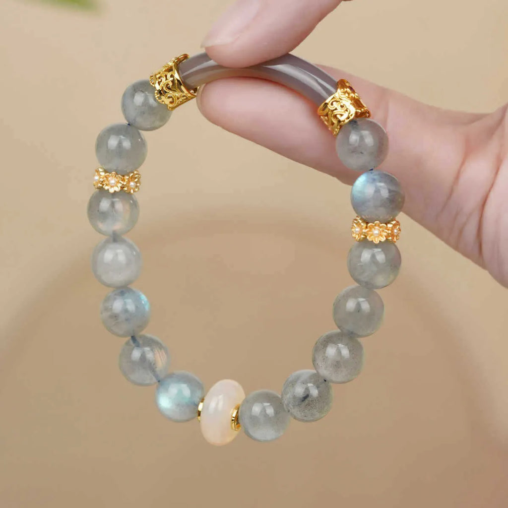 Emerald green Tian Shan Cui half bracelet with floating flower girl design and round motif on light background