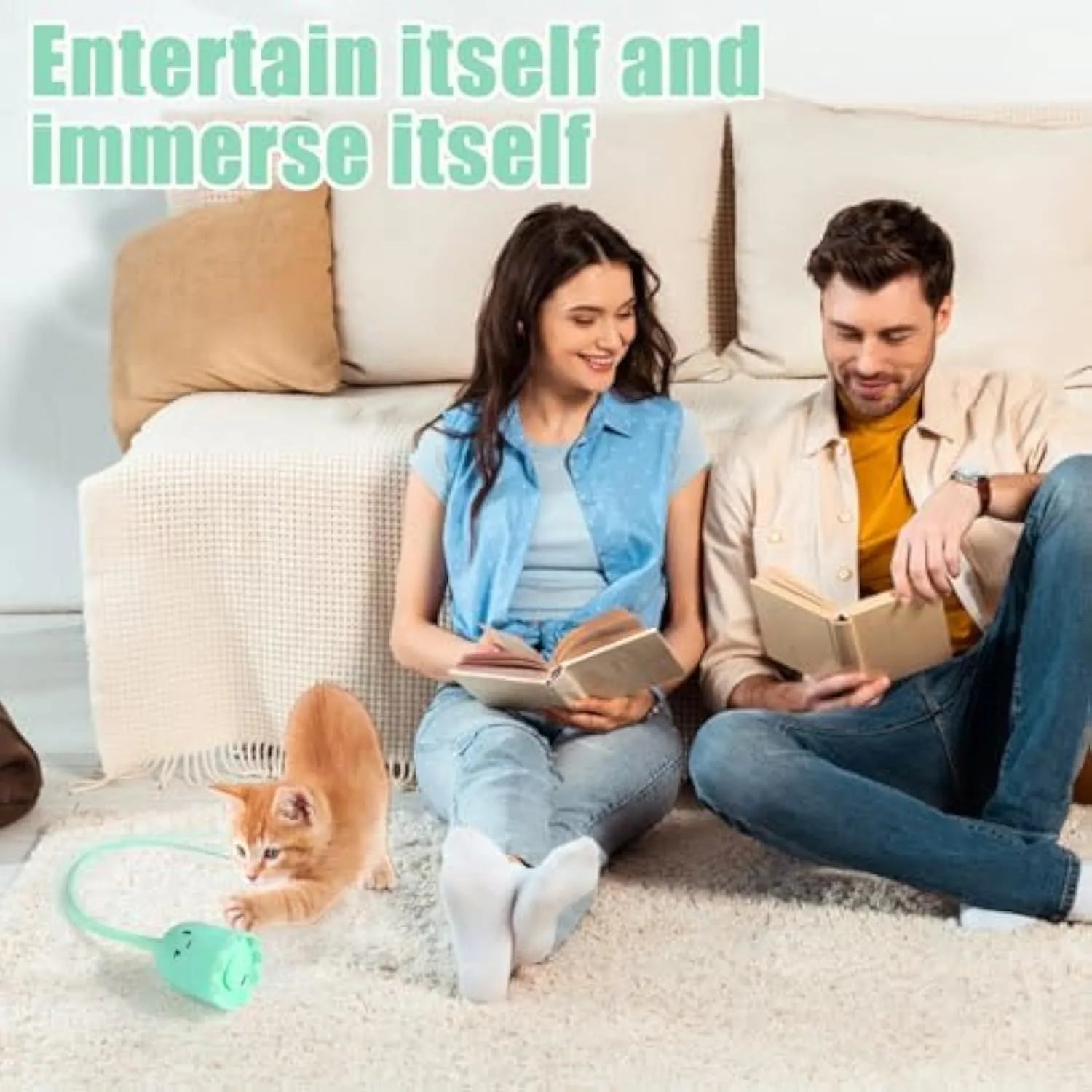 Green automatic electronic cat wand toy with a swinging silicone tail on a wooden floor.