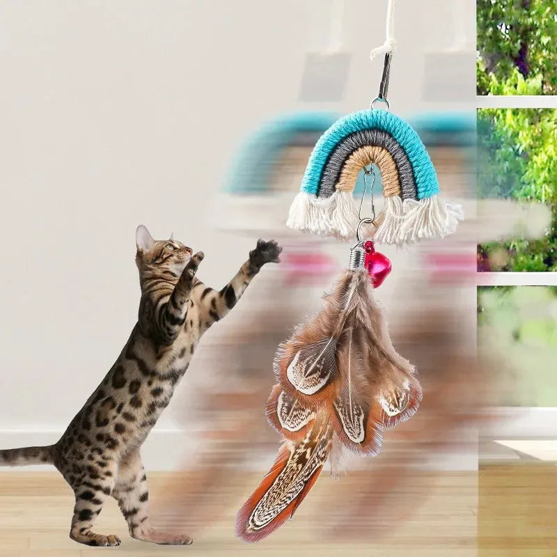 Blue feather rope cat toy hanging from door on elastic cord with adhesive clamp