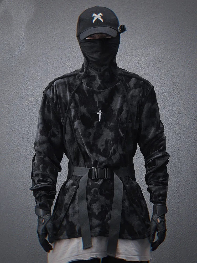 Man wearing a black tie-dye printed pullover sweater with drop shoulders and long sleeves.