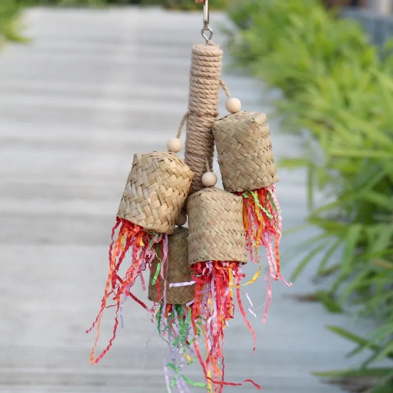 Colourful shredded paper and wood parrot hanging toy with sisal rope, 15 by 35 cm