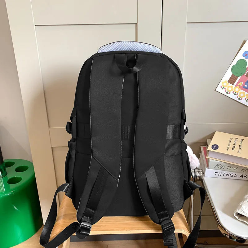 Nylon waterproof school backpack in black with curved shoulder strap and sewing line detail