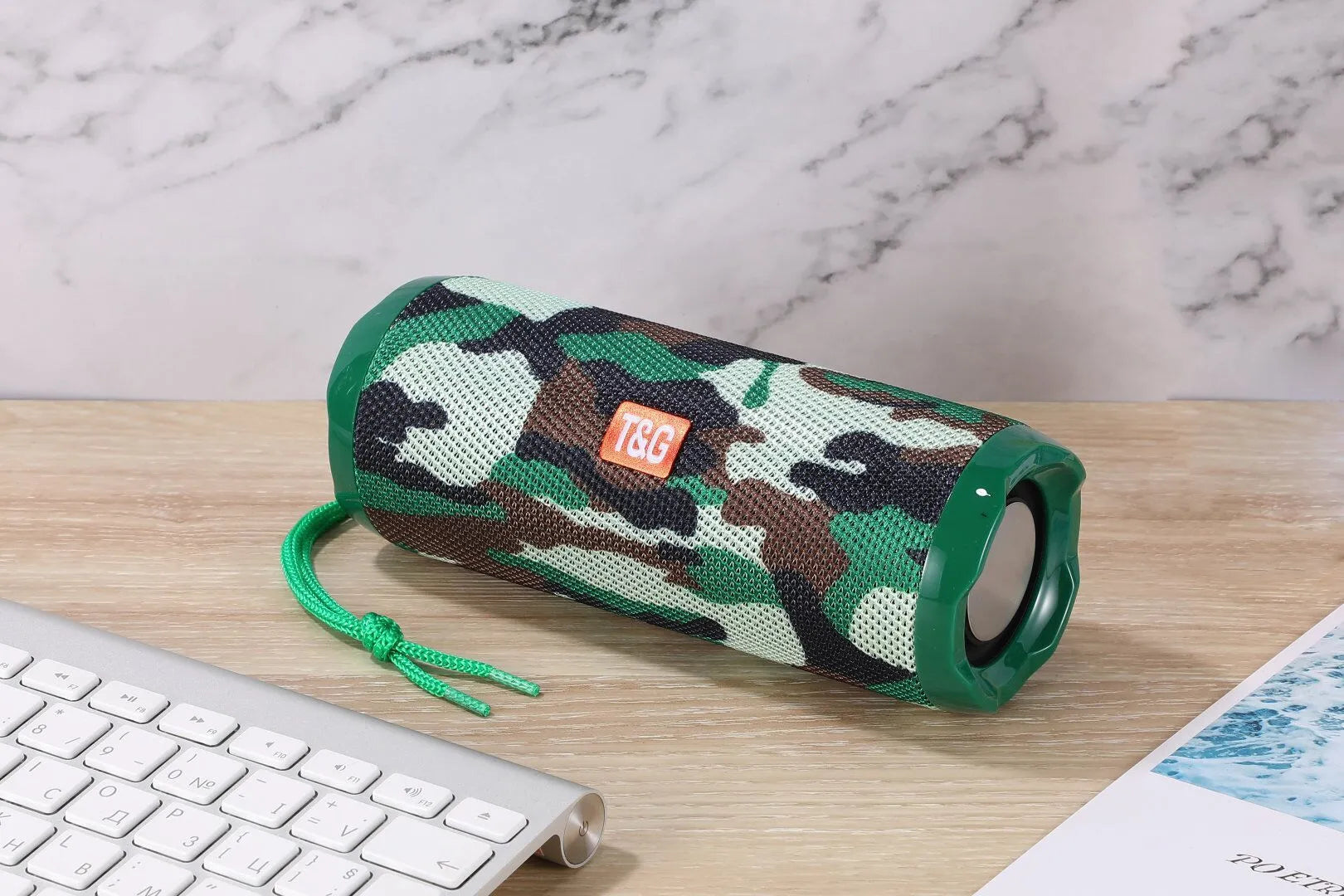 Fabric-covered portable Bluetooth speaker with integrated card holder in multiple colour options
