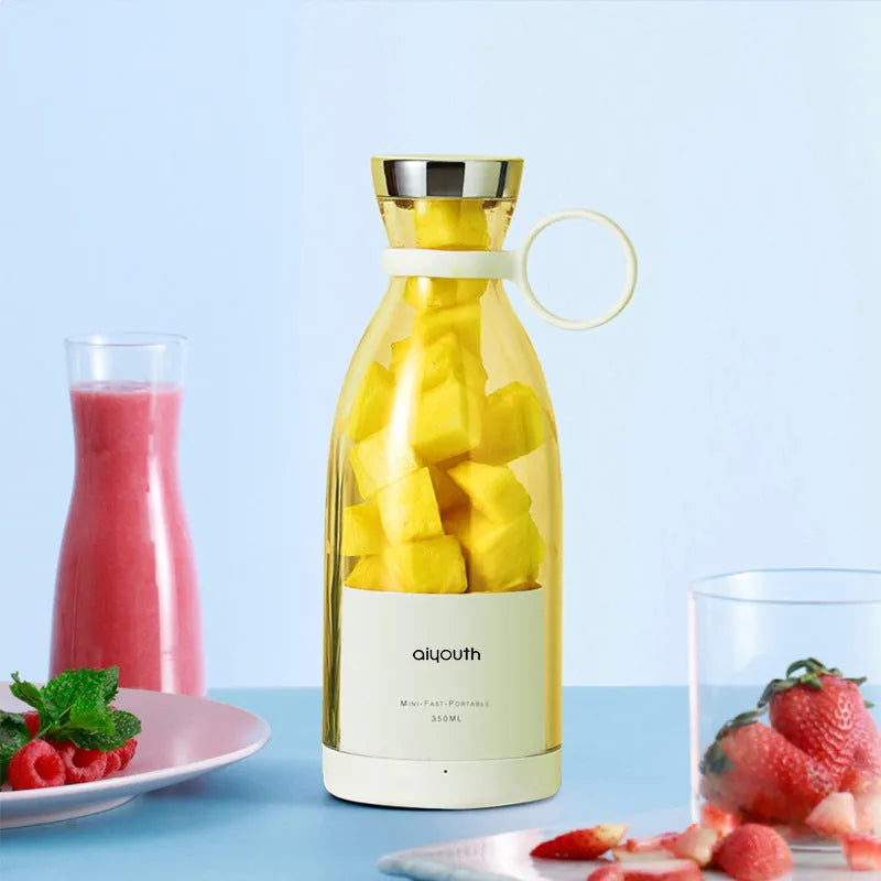Handheld USB rechargeable mini juicer in pink with PC food grade plastic liner and four cutter heads