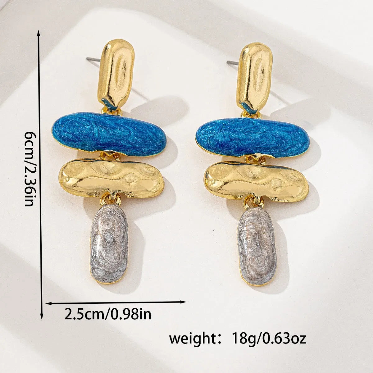 A pair of simple geometric stud earrings with a multicolour metallic electroplated finish.
