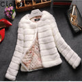 Women's short sleeve faux fur top in beige on a model, showing street fashion style.