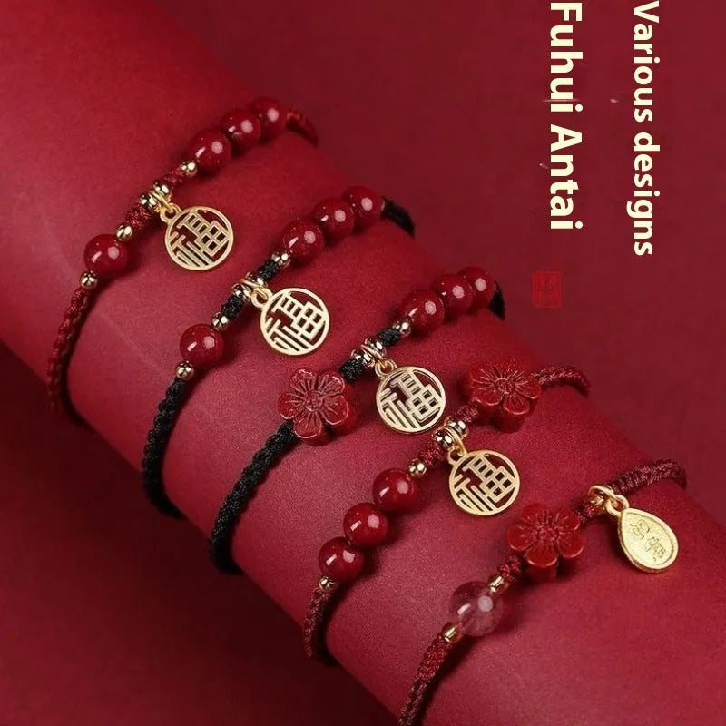 Cinnabar round bead blessing card bracelet with adjustable braided rope on neutral background