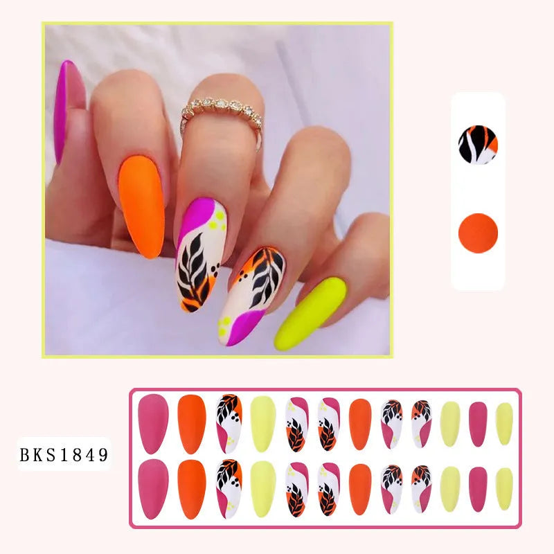 Wear Armour Medium Almond Frosted Nail Stickers four-box pack showing French leaves, leopard print, macaron, and plating designs.