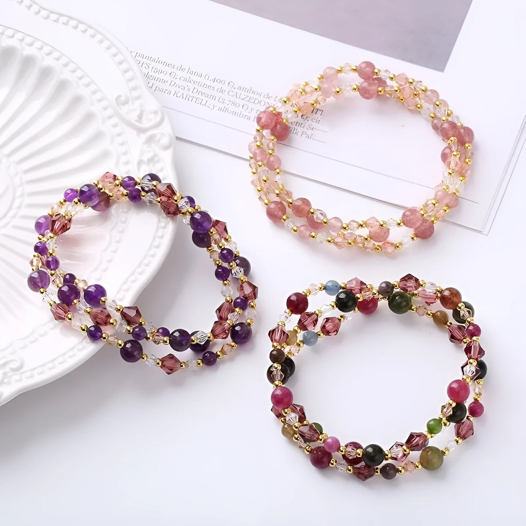 Handcrafted three-ring crystal bracelet with tourmaline, strawberry quartz and amethyst beads on adjustable cord