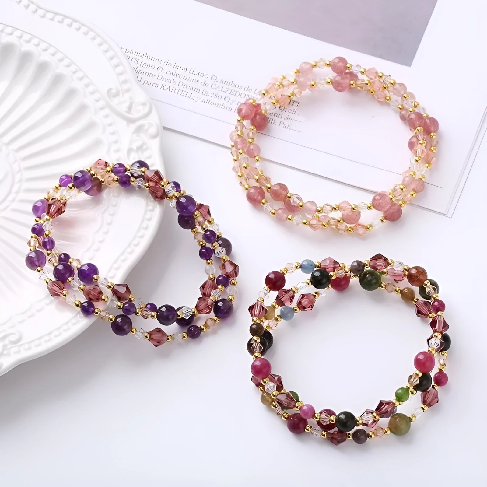 Handcrafted three-ring crystal bracelet with tourmaline, strawberry quartz and amethyst beads on adjustable cord