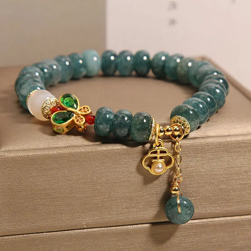 Blue water jade abacus beads crystal bracelet with white agate and butterfly motif on alloy base