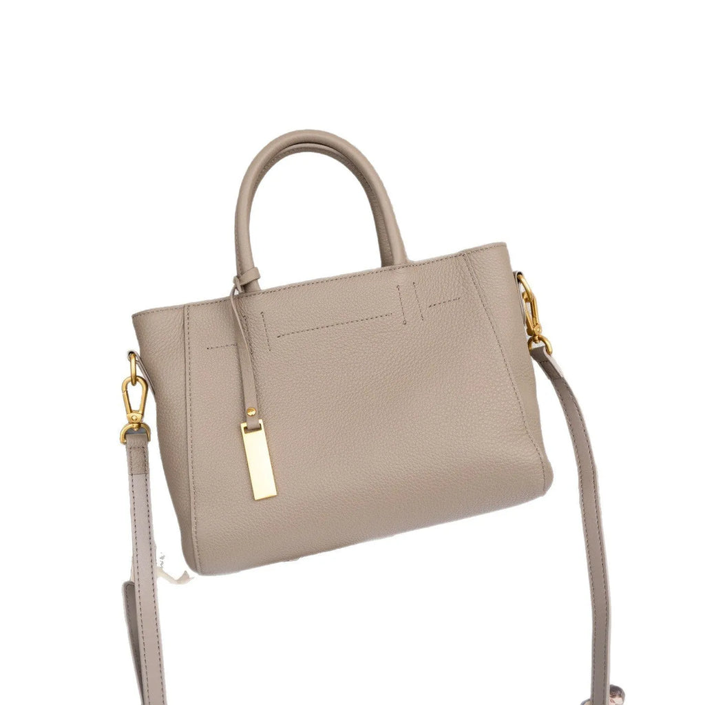 Portable genuine leather women handbag in soft cowhide with horizontal square shape and single strap, available in multiple colours