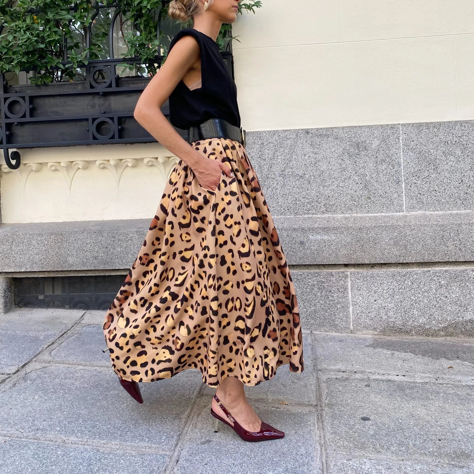 Brown leopard print women's A-line long skirt with big hem design on hanger