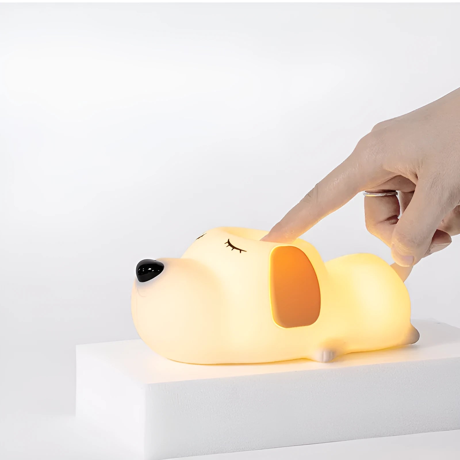Silicone night lamp in cartoon dog shape, two-colour glow, USB charging port visible at base