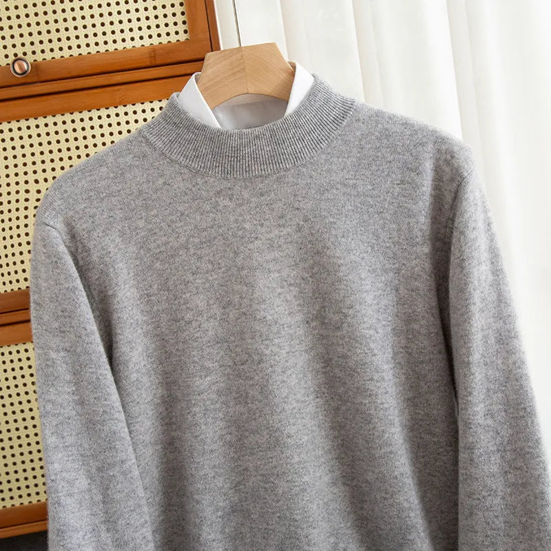 Man wearing a loose-fit half-collar wool sweater in a dark colour, showcasing the knit texture and collar style.