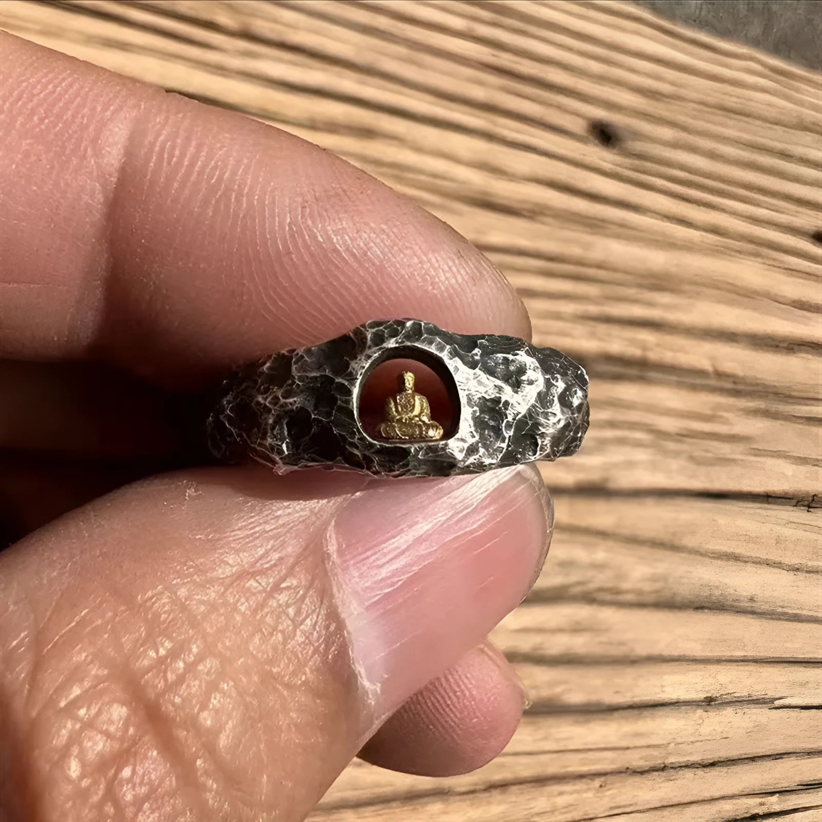 Hand-forged copper Grotto Buddha ring with rock texture and embossed symbol