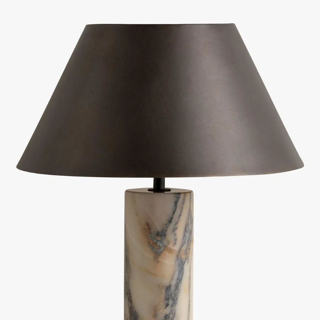 Black marble table lamp with modern minimalist design on wooden surface