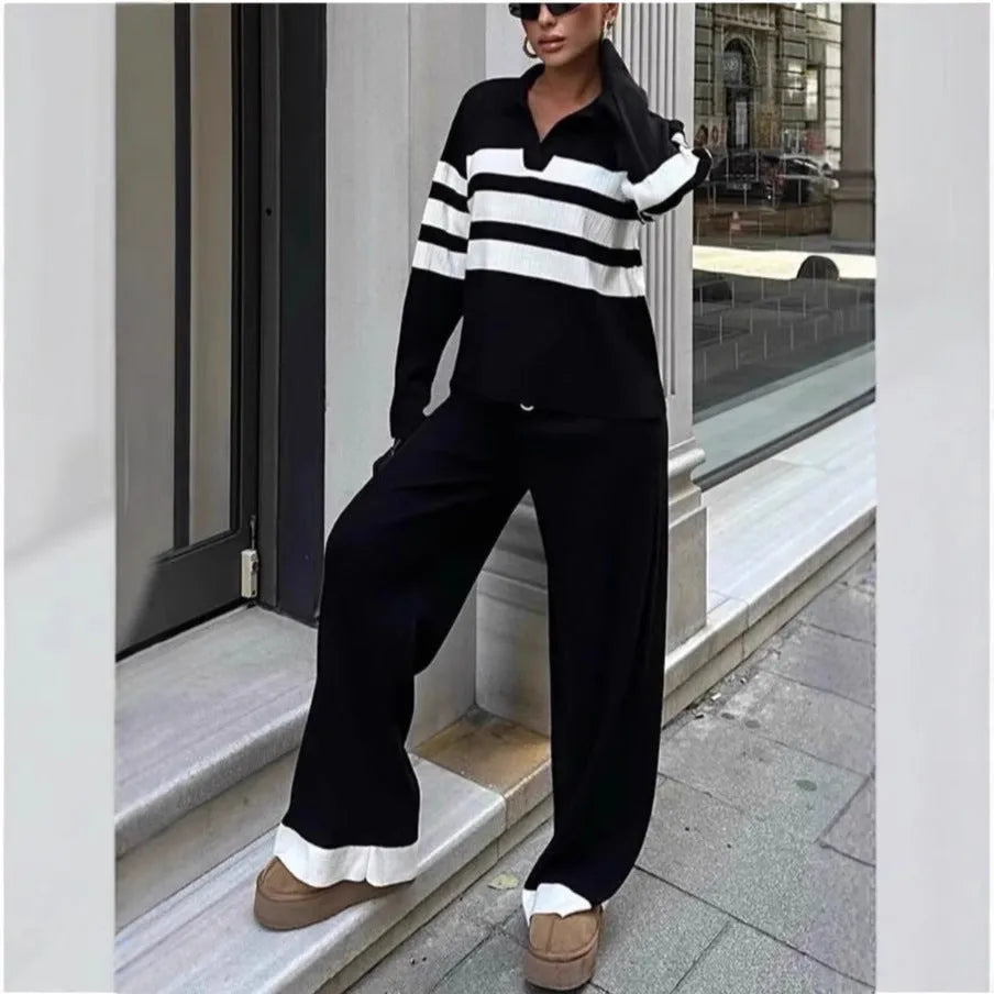 Women's black and white striped two-piece set with polo collar shirt and trousers