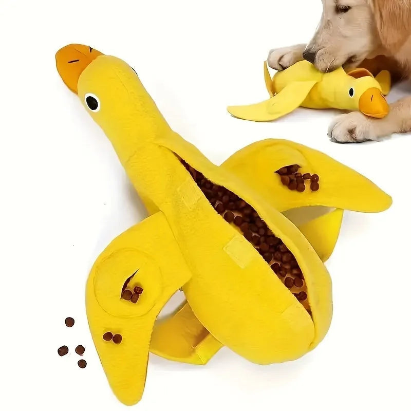 Yellow plush teddy duck dog toy with sound mechanism and treat leak hole for pet training