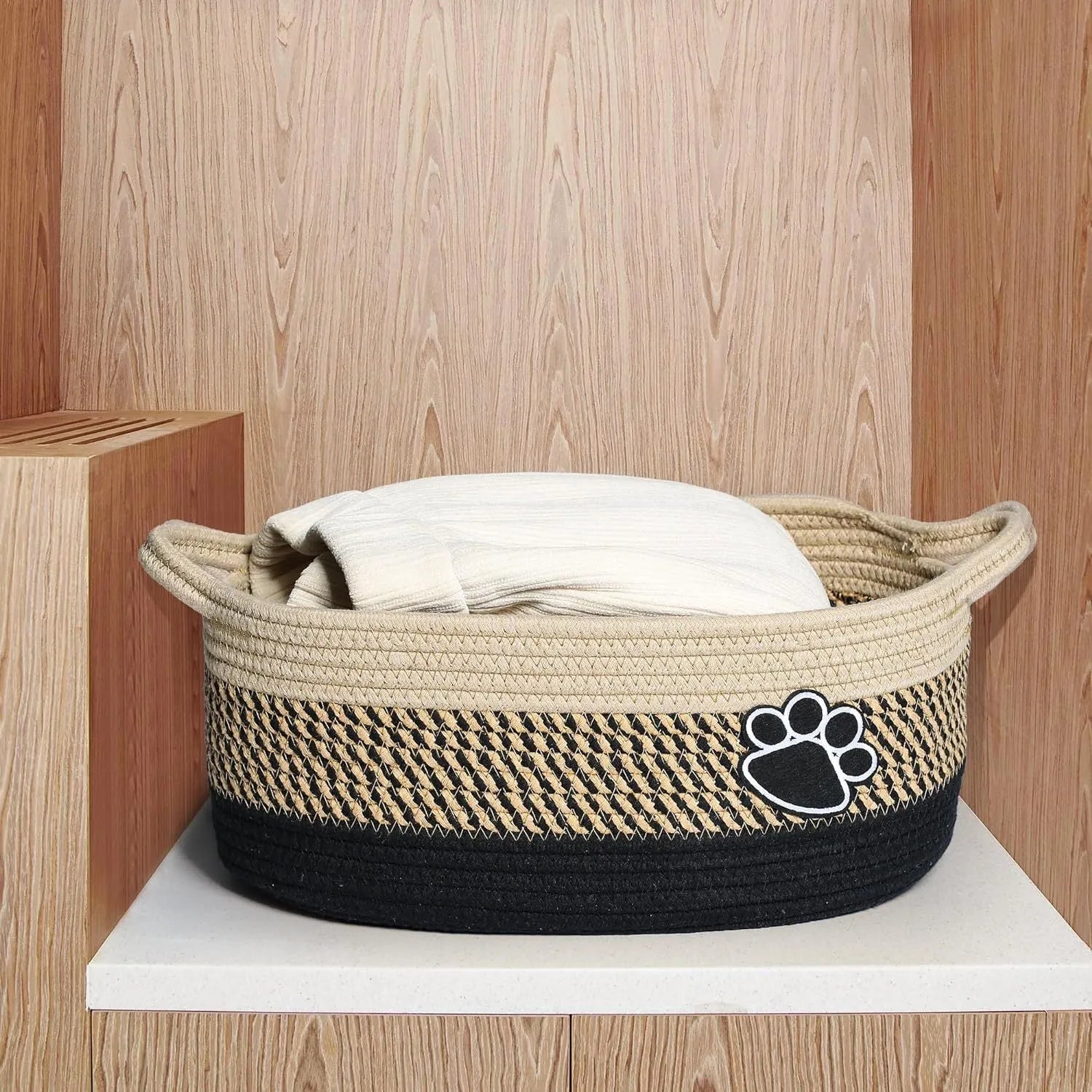Light beige handmade woven cotton rope storage basket with wood handle, dimensions 34x26x15cm.