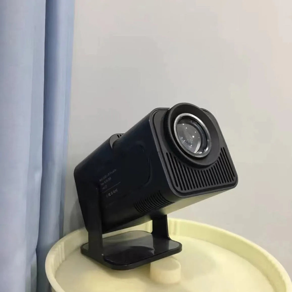 White HD wireless projector with handle showing 720p resolution capability and multi-standard power support for home gaming