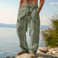 Man wearing loose fit wide-leg cotton casual trousers in a solid colour.