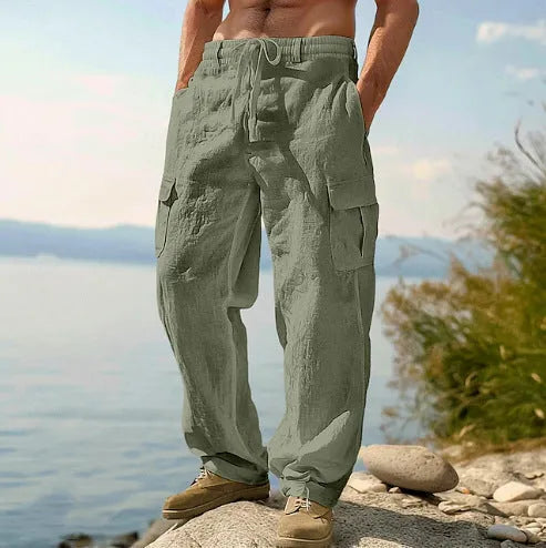 Man wearing loose fit wide-leg cotton casual trousers in a solid colour.