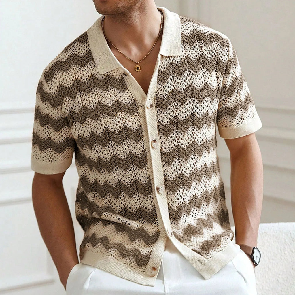 Blue short-sleeve sweater with textured hollow jacquard corrugated pattern and flocking details on a mannequin.