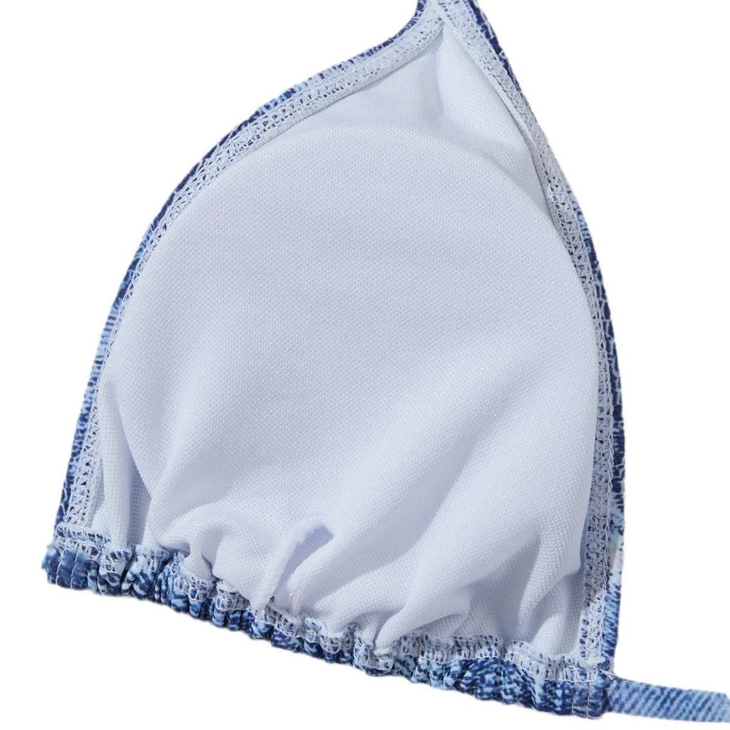 Women's denim blue printed bikini set with strap design, shown as a two-piece swimsuit.